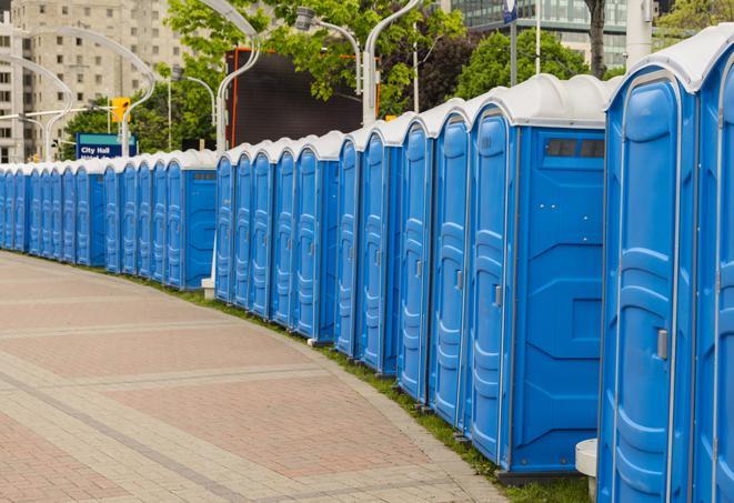 portable restrooms with sink and hand sanitizer stations, available at a festival in Opa Locka